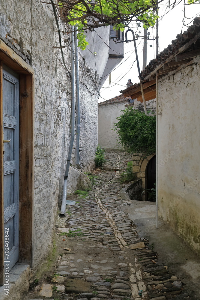 Narrow lane in the Mangalem historic, Ottoman-era district featuring cobbled floors, stone masonry walls. Berat-Albania-062