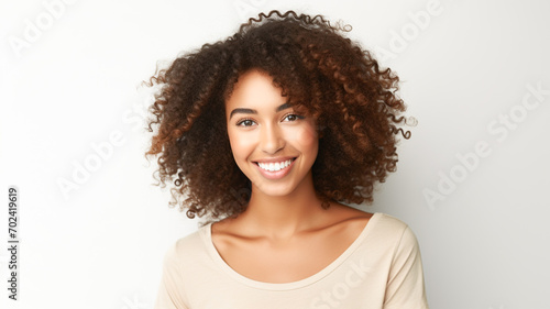 Beautiful woman beauty and skincare face portrait for natural afro, facial or hair care cosmetics. Healthy, beautiful and assertive model with curly hair shine and texture in studio. 