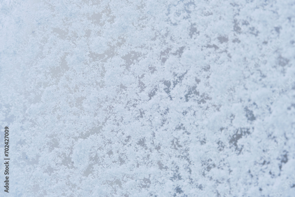 Background, glass is covered with snow and ice.