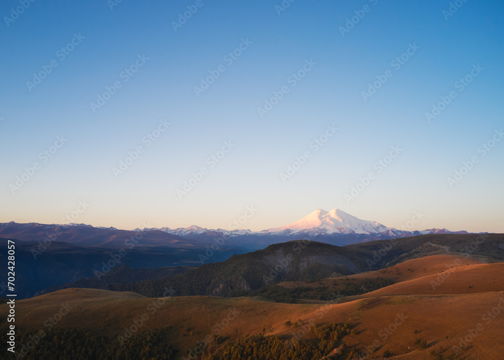 Mountainous terrain with a view of Elbrus at dawn. Drone photography.