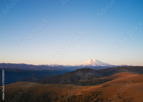 Mountainous terrain with a view of Elbrus at dawn. Drone photography.
