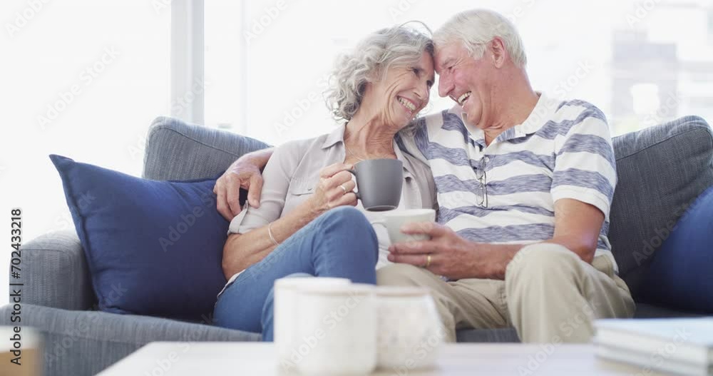 Hug, love and senior couple on a sofa with coffee break conversation and bonding, free or chilling at home. Happy, support and old people in living room with communication, tea and retirement comfort Hug, love and senior couple on a sofa with coffee break conversation and bonding, free or chilling at home. Happy, support and old people in living room with communication, tea and retirement comfort