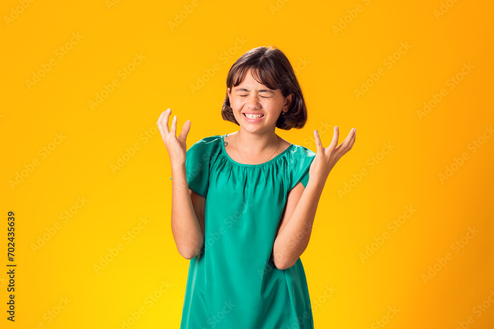Sad kid girl over yellow background. Frustration concept Sad kid girl over yellow background. Frustration concept