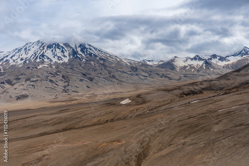 The Valley of Ten Thousand Smokes in Katmai National Park and Preserve in Alaska is filled with ash flow from Novarupta eruption in 1912. River eroding volcanic ash flow. Aerial view.