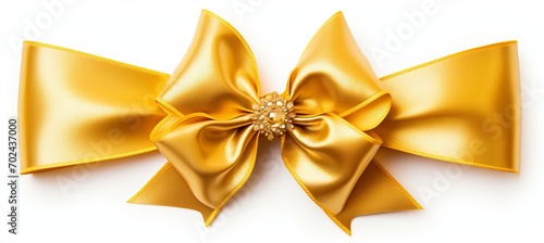 Golden ribbon bow for birthday or christmas banner, isolated on white background with copy space