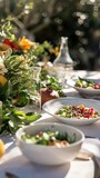A fresh, gourmet salad graces an elegant outdoor dining setup. Perfect for culinary magazines or lifestyle blogs. 