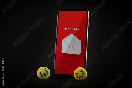 Emoji face and smartphone on black background. Emoticon concept.