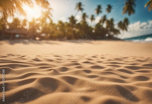 Sand with blurred Palm and tropical beach bokeh background Summer vacation and travel concept