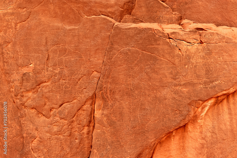 Elephants, prehistoric petroglyphs, rock art in Tadrart Rouge, Tadrart Akkak, Sahara, Algeria, horizontal view Elephants, prehistoric petroglyphs, rock art in Tadrart Rouge, Tadrart Akkak, Sahara, Algeria, horizontal view