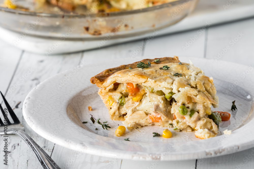 A slice of homemade turkey pot pie, ready for eating.