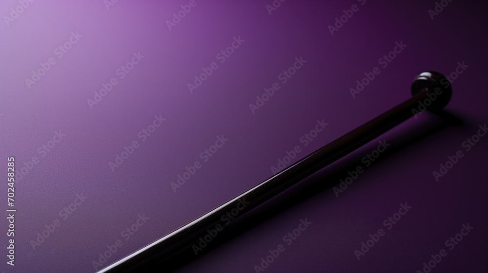 Elegant baton on a purple backdrop with dramatic lighting Elegant baton on a purple backdrop with dramatic lighting