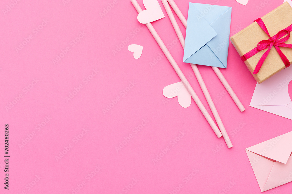 Paper hearts, love letters and gifts on a pink background. Valentine's Day. Love concept. Top view. Space for text.