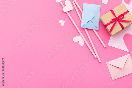 Paper hearts, love letters and gifts on a pink background. Valentine's Day. Love concept. Top view. Space for text. © Yulia Kravchenko