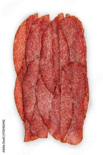 Feine Salami mit Kräuterkrust in Scheiben auf weißem Hintergrund angeordnet photo