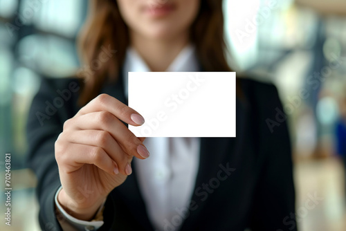 Businesswoman shows blank business card, cut out - stock png.