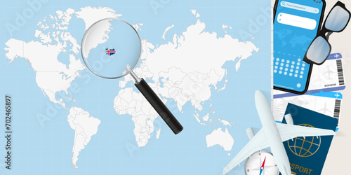 Iceland is magnified over a World Map, illustration with airplane, passport, boarding pass, compass and eyeglasses.