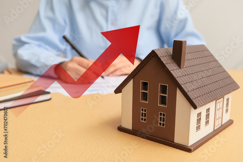 Model of house on table and...