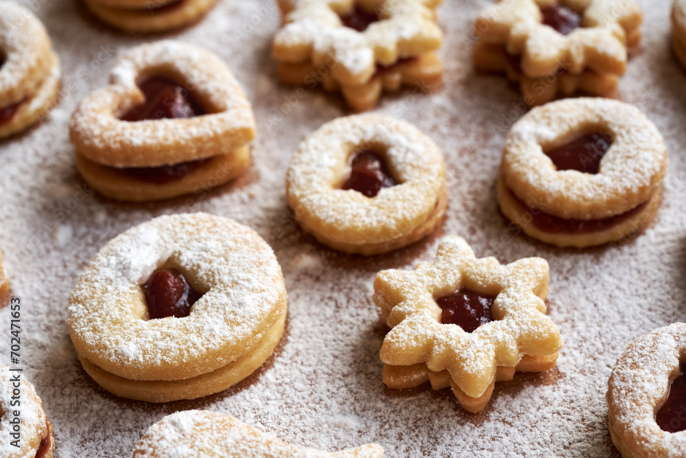 Linzer Christmas cookies filled with marmalade and dusted with sugar