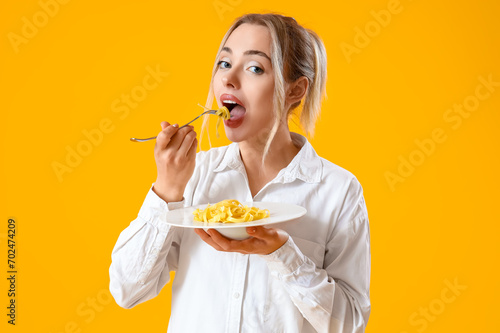 Young woman eating tasty pa...