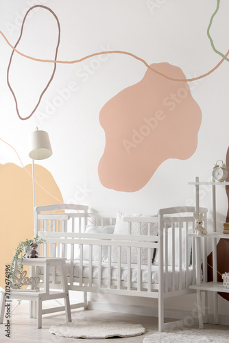 Fototapeta Naklejka Na Ścianę i Meble -  Baby crib in interior of stylish bedroom