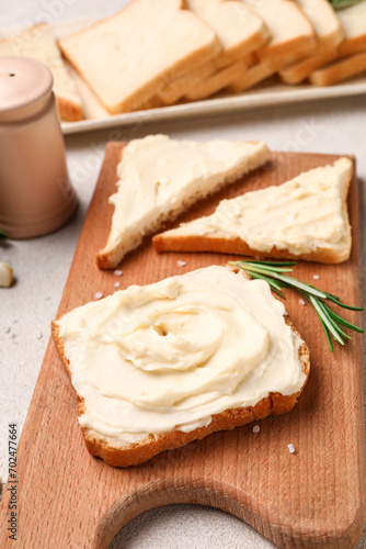 Wooden board of tasty toast...