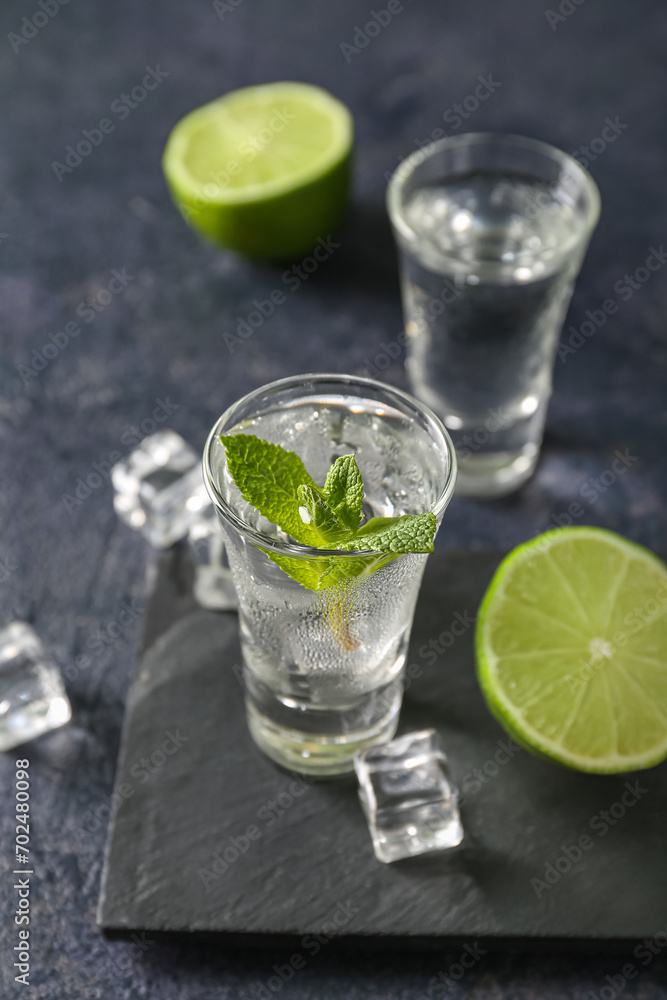 Glass of cold vodka on black background Glass of cold vodka on black background