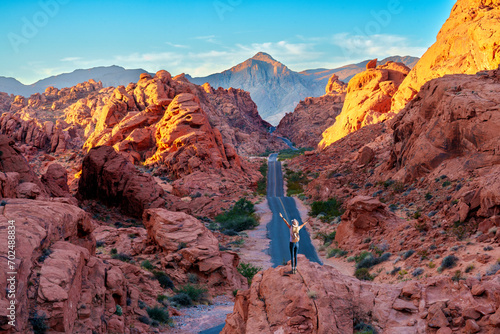 Hiker enjoying  View, Rock Formations, .Valley of Fire State Park..Las Vegas, Nevada, USA photo
