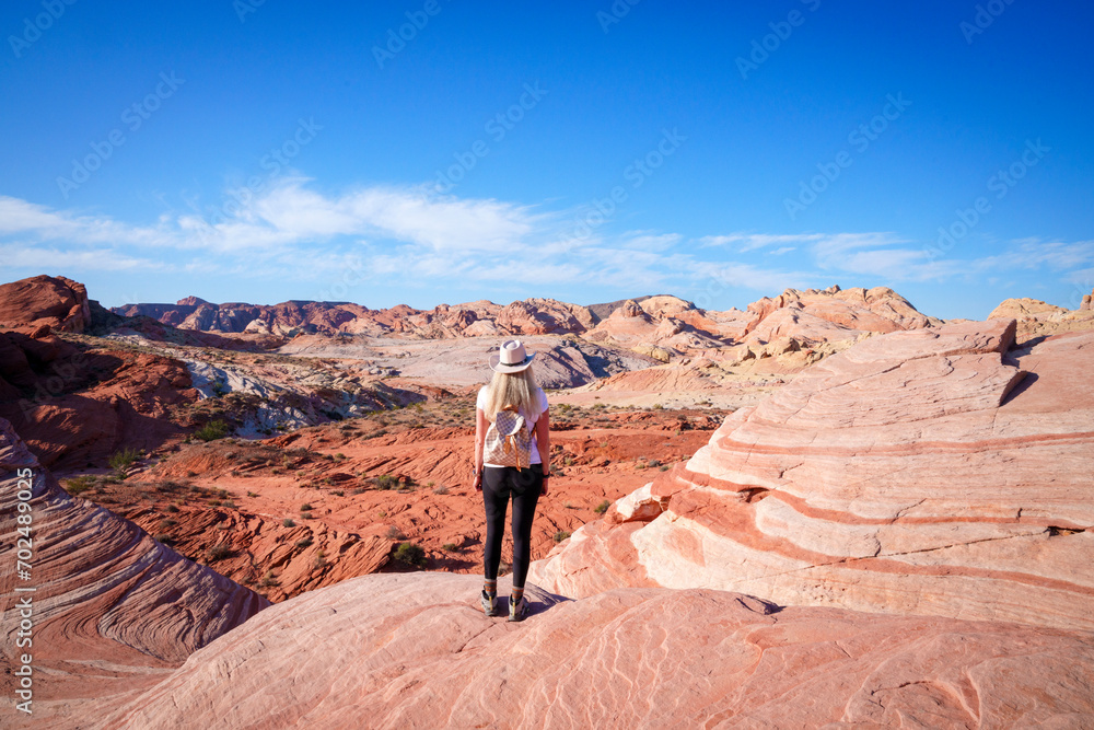 Hiker enjoying the view, View, Rock Formations, .Valley of Fire State Park..Las Vegas, Nevada, USA