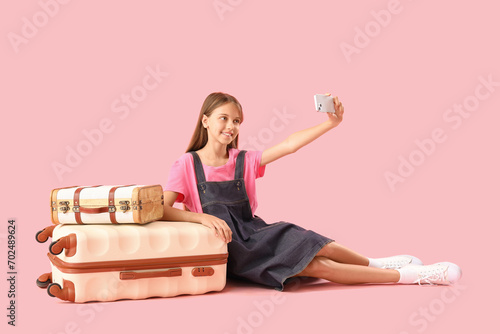 Happy little girl with suit...