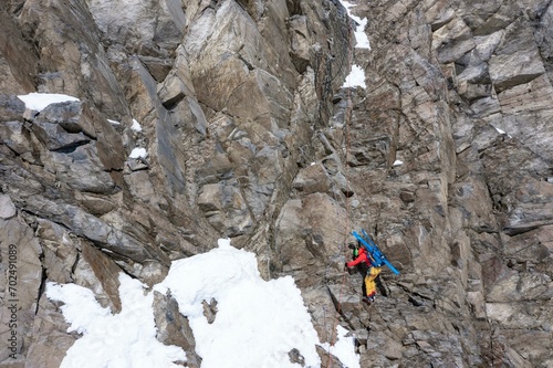 High altitude tour, ski tourers abseil down a cliff, Stubai, Tyrol, Austria, Europe photo