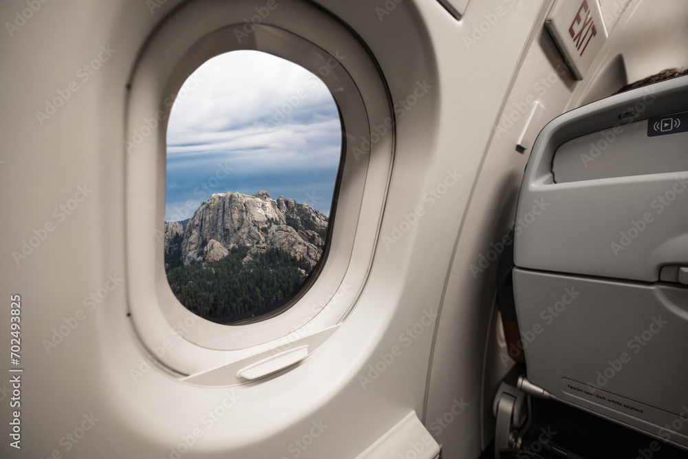 The four presidents at Mount Rushmore National Park in South Dakota through the window of an airplane
