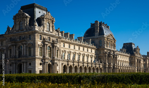 View of impressive building of Louvre Palace on sunny autumn day..