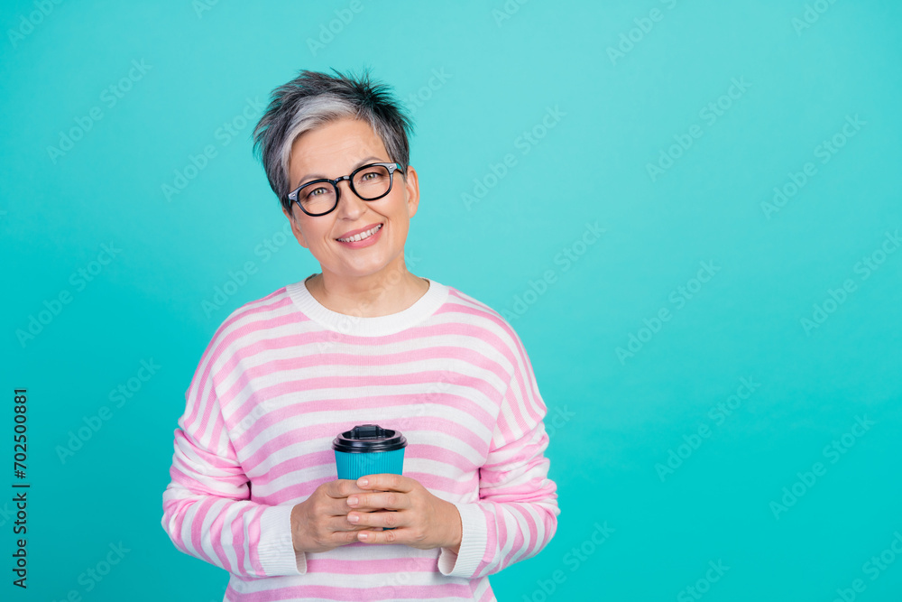 Photo of dreamy charming lady wear striped sweater spectacles enjoying coffee empty space isolated turquoise color background Photo of dreamy charming lady wear striped sweater spectacles enjoying coffee empty space isolated turquoise color background