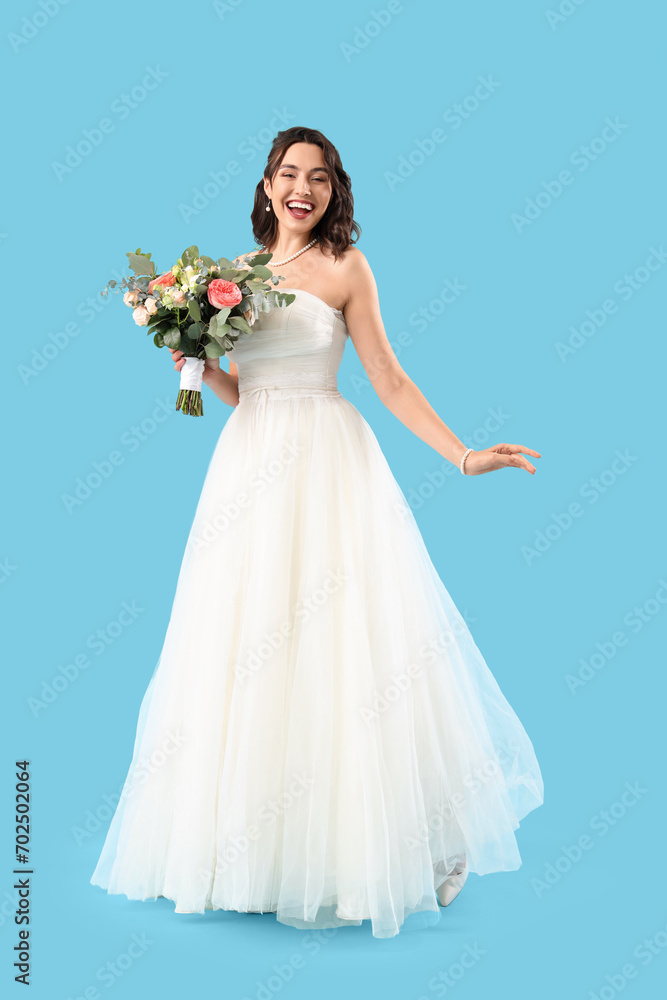 Beautiful bride with wedding bouquet on blue background Beautiful bride with wedding bouquet on blue background