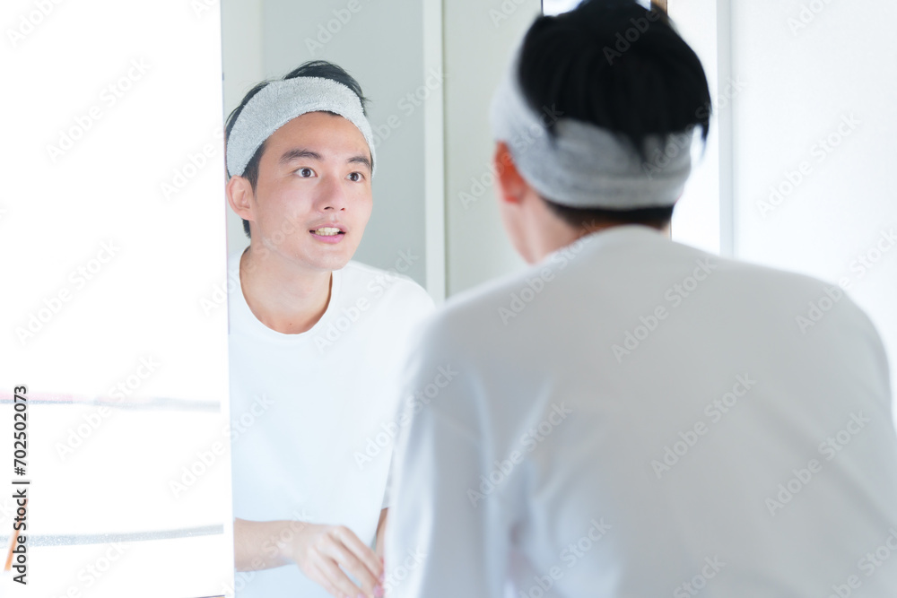 Obraz premium 洗顔をする男性 メンズビューティー コンセプト