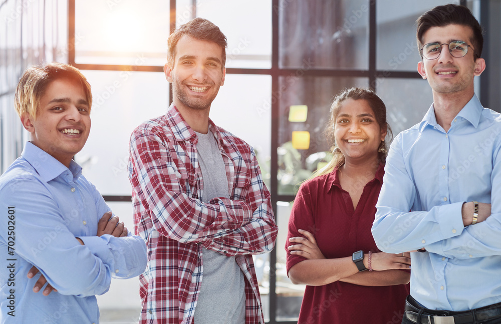 Everybody brings a different skill to the team. Portrait of a diverse group of coworkers standing in an office.