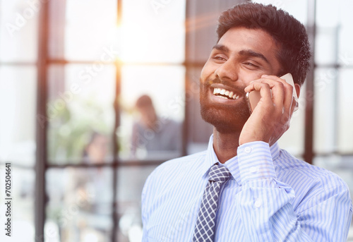 Close up portrait business man talking over cell phone.