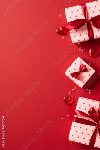Valentine's day vertical banner design. Gift boxes with hearts on red background. Love, romance concept.