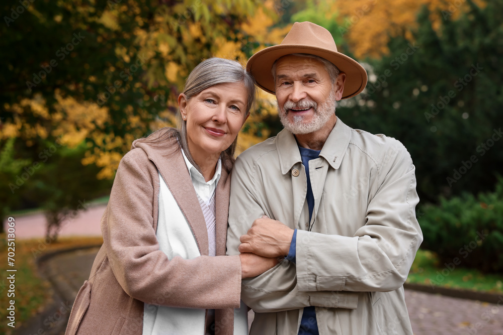 Portrait of affectionate senior couple in autumn park Portrait of affectionate senior couple in autumn park