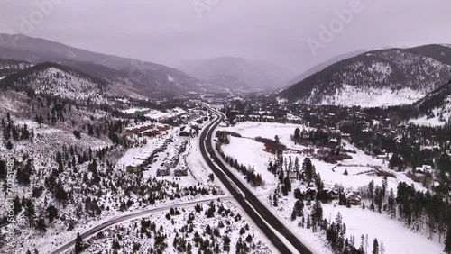 Cinematic Colorado aerial drone winter December Christmas Summit Cove Keystone Ski Resort Epic Local Pass entrance Rocky Mountains i70 Breckenridge Vail Summit County High Country backwards motion photo