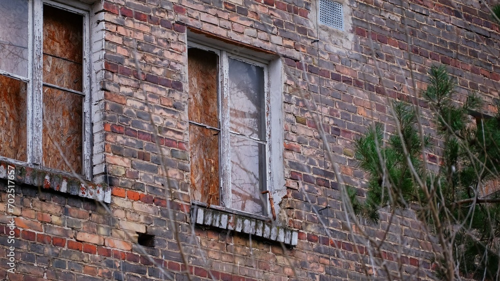 Shattered Glass in Plywood Boarded Up Window of Ruined Neglected Abandoned Building Shattered Glass in Plywood Boarded Up Window of Ruined Neglected Abandoned Building