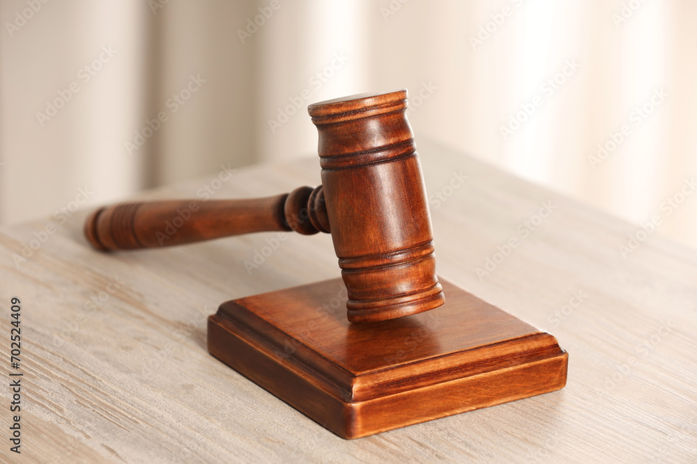 Law concept. Gavel on wooden table, closeup Law concept. Gavel on wooden table, closeup