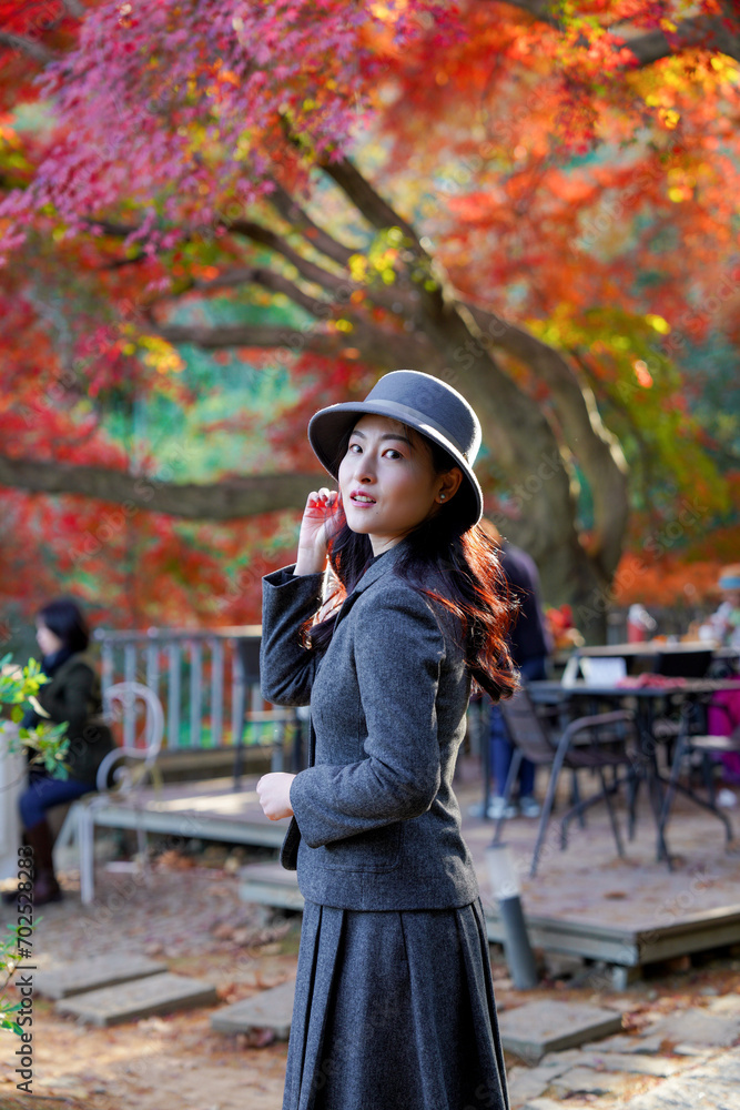 The girl and the old maple tree in the mountains The girl and the old maple tree in the mountains