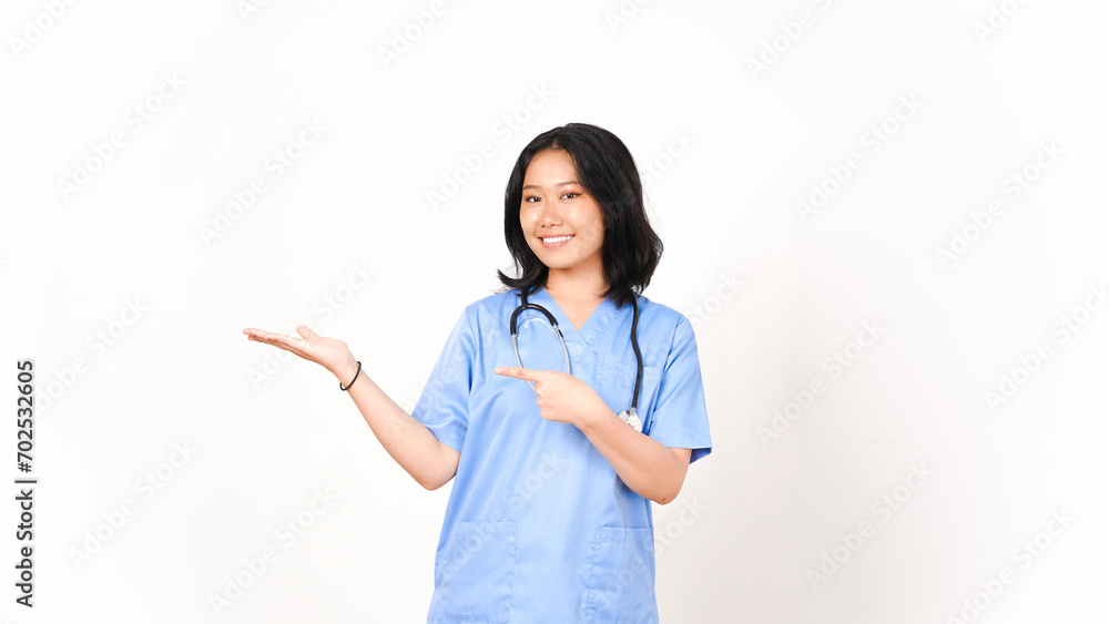 Young Asian female doctor pointing copy space on palm hand isolated on white background Young Asian female doctor pointing copy space on palm hand isolated on white background
