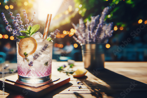 Stunning Lavender cocktail Purple drink in a glass on white background with ice and lavender flowers. Iced cold summer drink, lemonade. #702533452