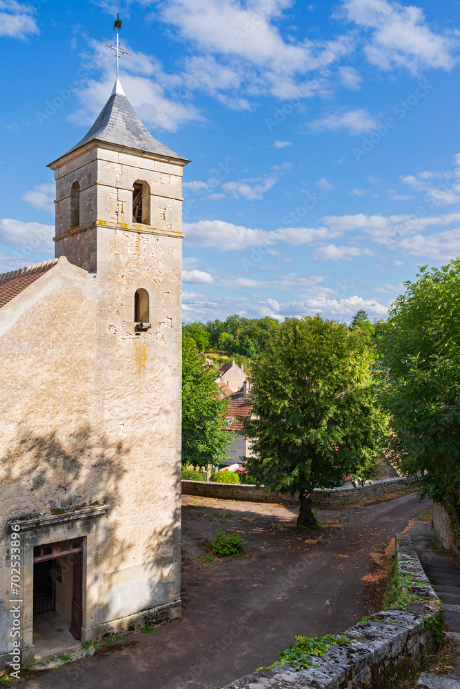 church and bell tower in village or commune of chevroches france nievre department