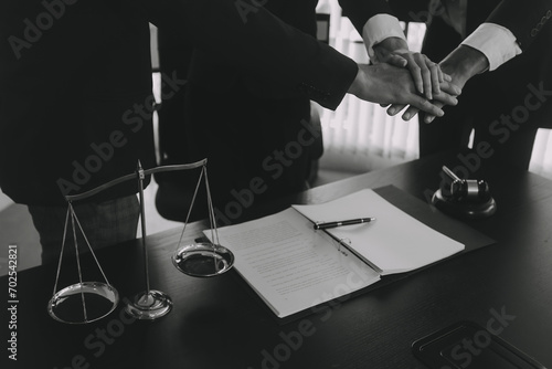 Group of experienced attorneys and lawyers giving consultation to client, helping with difficult lawsuit, explaining legal procedures and discussing agreement terms. Law services and support concept