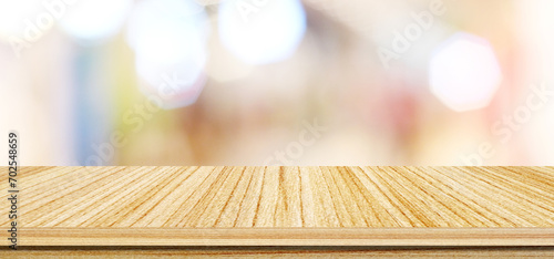 Wood table background and blur background, Empty wooden counter, shelf surface over blur bokeh background, Wood table top for retail shop, store product display backdrop, banner, mock up, template