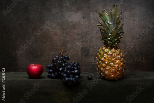 Still life with apple, grapes and pineapple