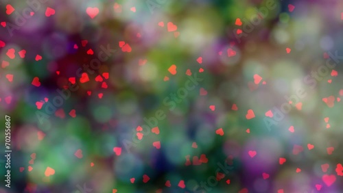 Red hearts movement on colorful blurred bokeh background. Concept Valentine's day animation. 